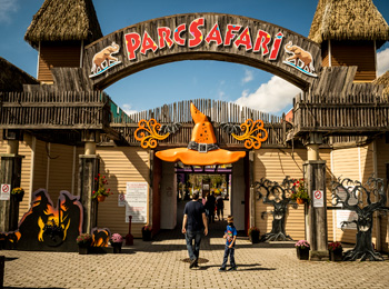 Father and son at the entrance of Parc Safari, decorated for Halloween.