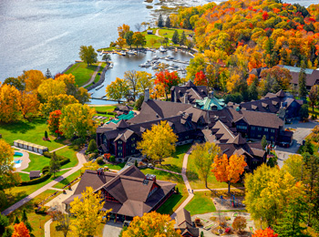 Fairmont Le Château Montebello and the Ottawa River in the fall.