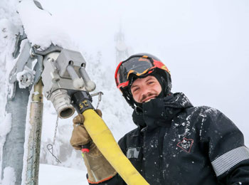 Man working outdoors in winter.