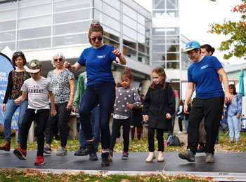 Group of kids learning a dance.