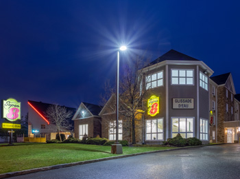 Hotel exterior at night.