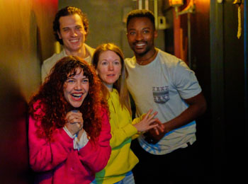 Group of four happy-looking people.